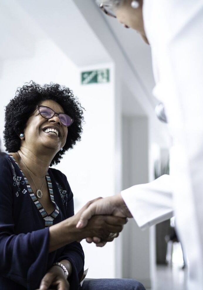 woman meeting with hearing clinic technician